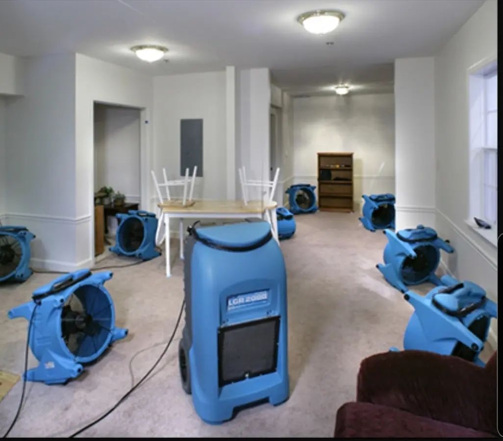 Air movers and dehumidifier setup for Water Damage Restoration in Forsyth